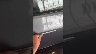 Opening the Cadillac Lyriq’s door. 