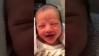 Newborn baby gives an adorable smile. What a lovely smile! 😍