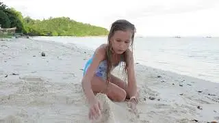 Children playing on the beach. 4k