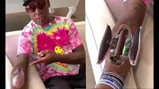 DENNIS RODMAN ENJOYING his NEW ROBOTIC CIGAR ARM!