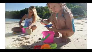 Сhildren play in the sandbox on the beach 4K