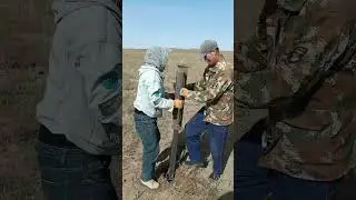 Manually Drilling Hole For Installing Fence Net On The Grassland !