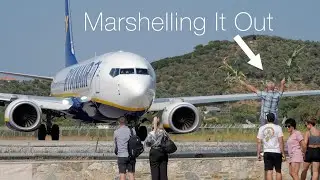 Plane Spotter Marshalls A Ryanair 737 to Take Off at Skiathos Airport with Jet Blast