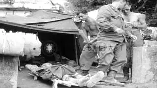 Infantrymen of 165th Infantry, 27th Division carry casualties to regimental aid s...HD Stock Footage