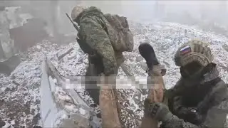 Evacuation of a wounded Ukrainian soldier by a Russian assault squad