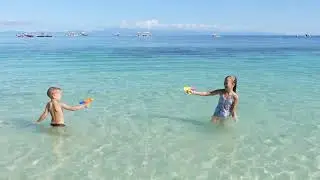 Children playing on the beach 4K