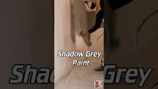 Spray Painting grey trade paint on walls 