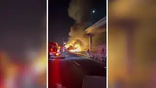 Truck carrying barrels of brake fluid catches fire