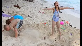 Children playing on the beach with sand 4k