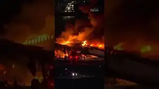 Plane bursts into flames after collision at Japan's Haneda airport
