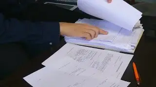 Man Checks Stack Of Documents Stock Video