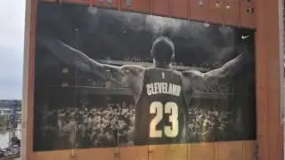 Watch as the LeBron James banner is re-installed with a gold championship patch