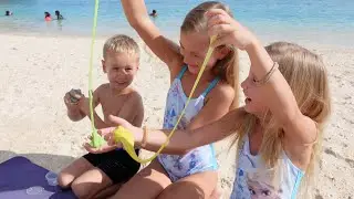 Children playing on the beach 4K