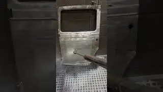 Pressure washing the paint off this door after a chemical dip. What vehicle did this come off of?