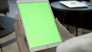 Woman holding a tablet with a chroma key screen   Free Stock Video