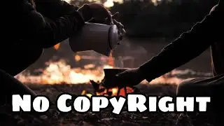 People pouring a warm drink around a campfire || NO COPYRIGHT