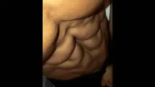 Abs of steel / bodybuilder pumping muscles