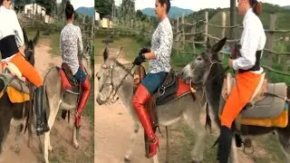 Two young lady's donkey riding 