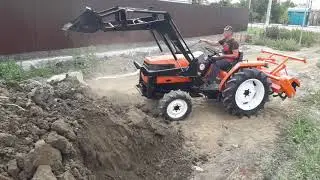 Трактор KUBOTA  с куном в работе