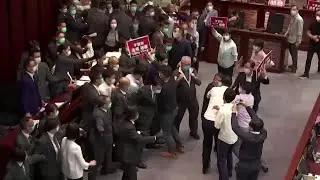 Pro-China and democratic lawmakers scuffle in Hong Kong legislature