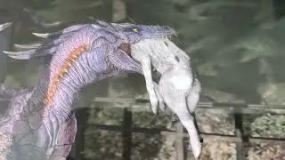 A dragon eating a Wolf.
