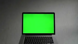 Laptop computer with a green screen   Free Stock Video