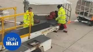 Manchester Airport staff carelessly THROW baggage onto cart