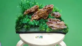 Декор для аквариума в виде готовой композиции из пластиковой камней и растений